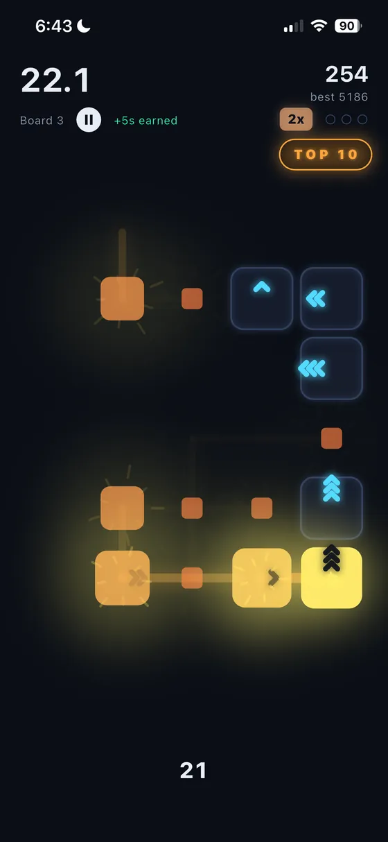 A chain reaction crossing the board, orange tiles firing into blue arrow tiles, with a two times multiplier and five seconds earned on the clock.
