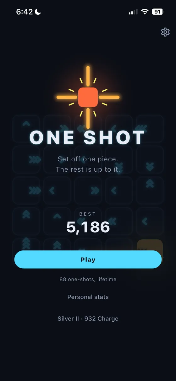 The One Shot Cascade title screen: a glowing orange tile throwing off rays above the game's name, a personal best of 5,186, and a Play button.