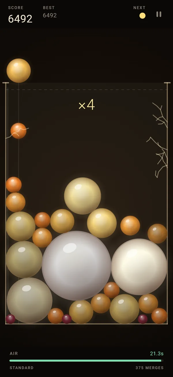 A real game of Squeeze the Orbs: amber and pearl orbs piled in a glass jar, two big white Lanterns near the floor, hairline cracks in the right-hand wall, a score of 6492 and a green AIR bar.